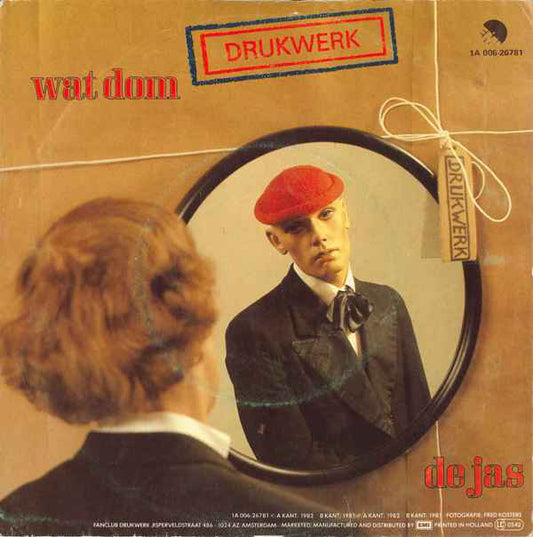 Drukwerk - Wat Dom 43330 Vinyl Singles Vinyl Zeer Goed / Hoesje Goed "VINYLSINGLES.NL"