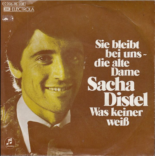 Sacha Distel - Sie Bleibt Bei Uns Vinyl Singles Vinyl Very Good (VG) <br> Hoes Good Plus (G+)