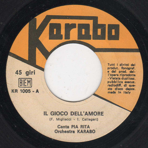Pia Rita / Giuliano / Orchestra Karabo - Il Gioco Dell'Amore / Il Sole È Tramontato Vinyl Singles VINYLSINGLES.NL
