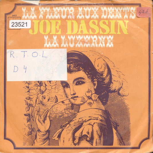 Joe Dassin - La Fleur Aux Dents (B-Keus) Vinyl Singles Vinyl Goed / Hoes Sticker